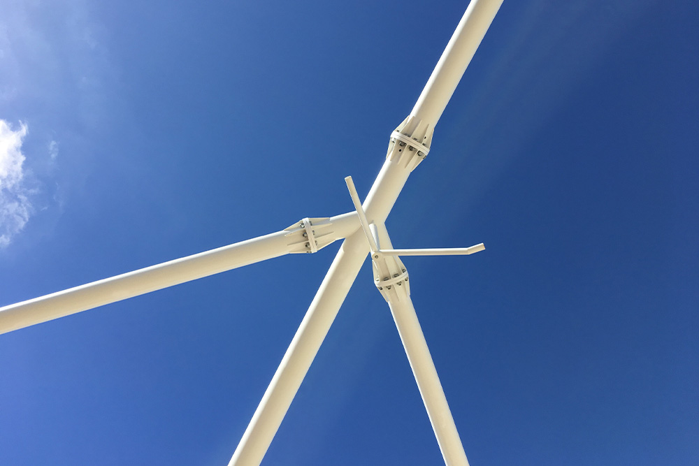 Steel Roof Support Beams with Blue sky above.