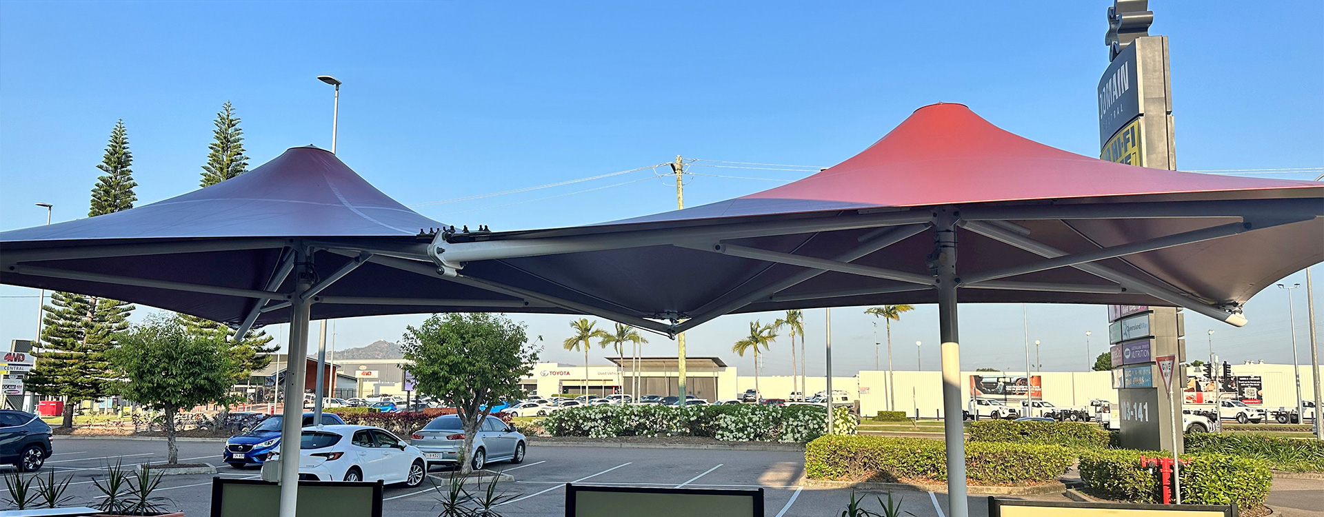 The terracotta coloured canopies of the Coffee Club Domain Monaco Shade Structures